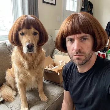 A man and his golden retriever on the sofa, both in the chestnut bob